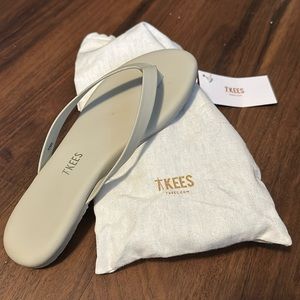 Brand new TKEES flip flops.